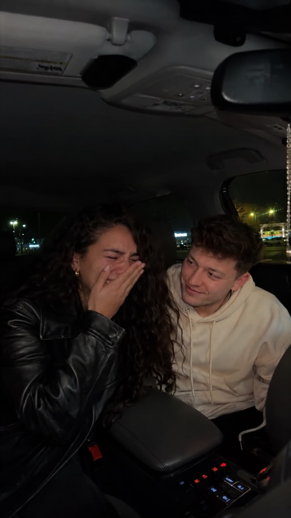 Couple surprised by a custom love song in a car