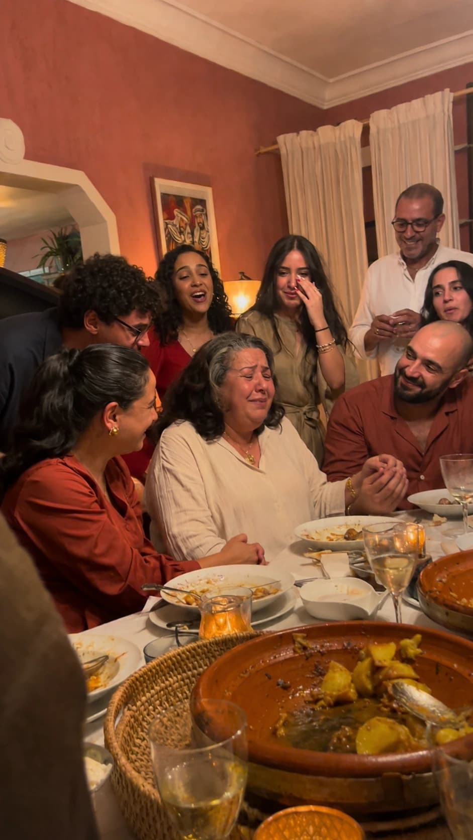 Family dinner moment after a mother hears her song